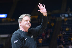 His home for 21 years, Mike Carey honored during return to WVU
